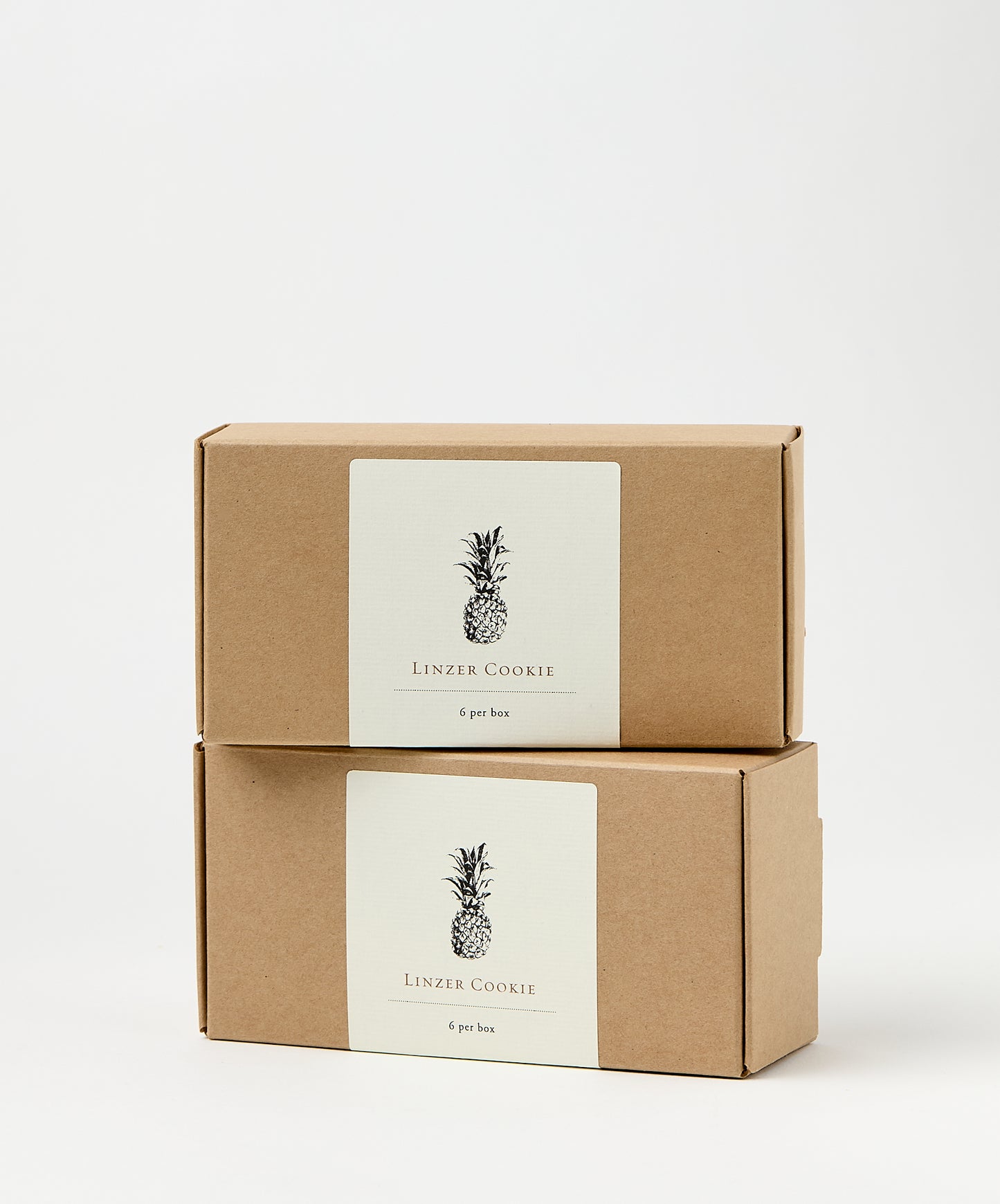 linzer cookie box with pineapple illustration