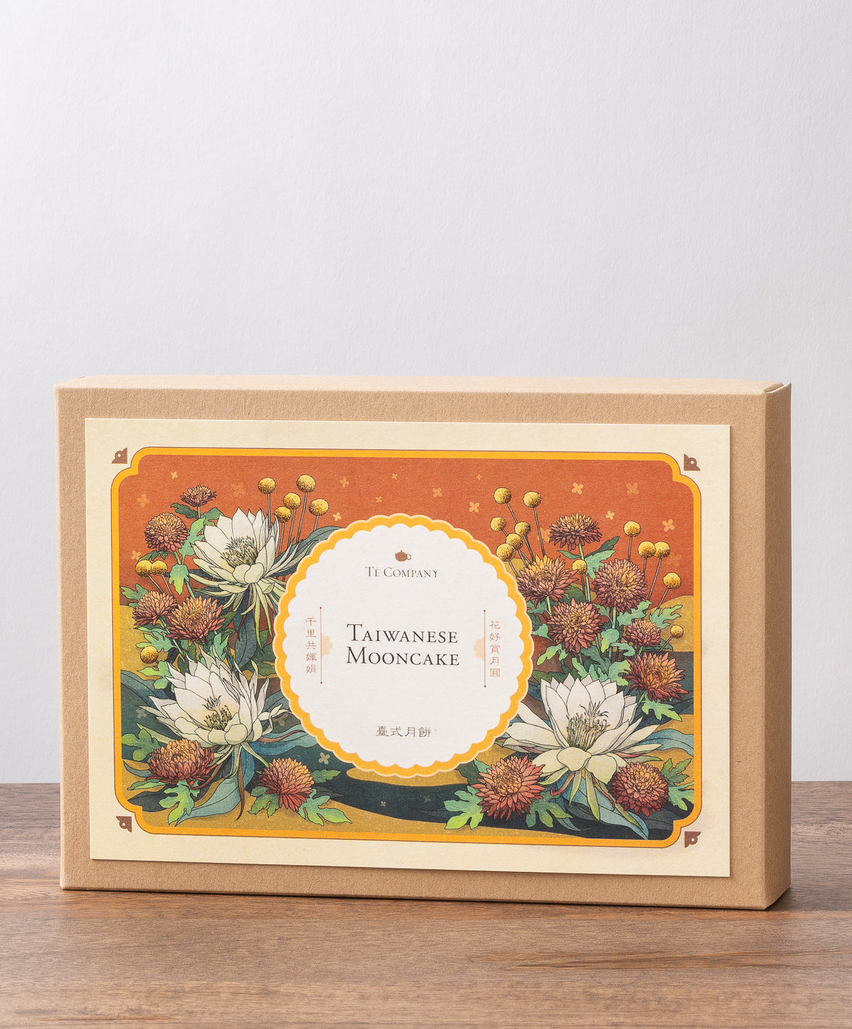 A box labeled Taiwanese Mooncake by Te Company with an floral illustration featuring flowers.