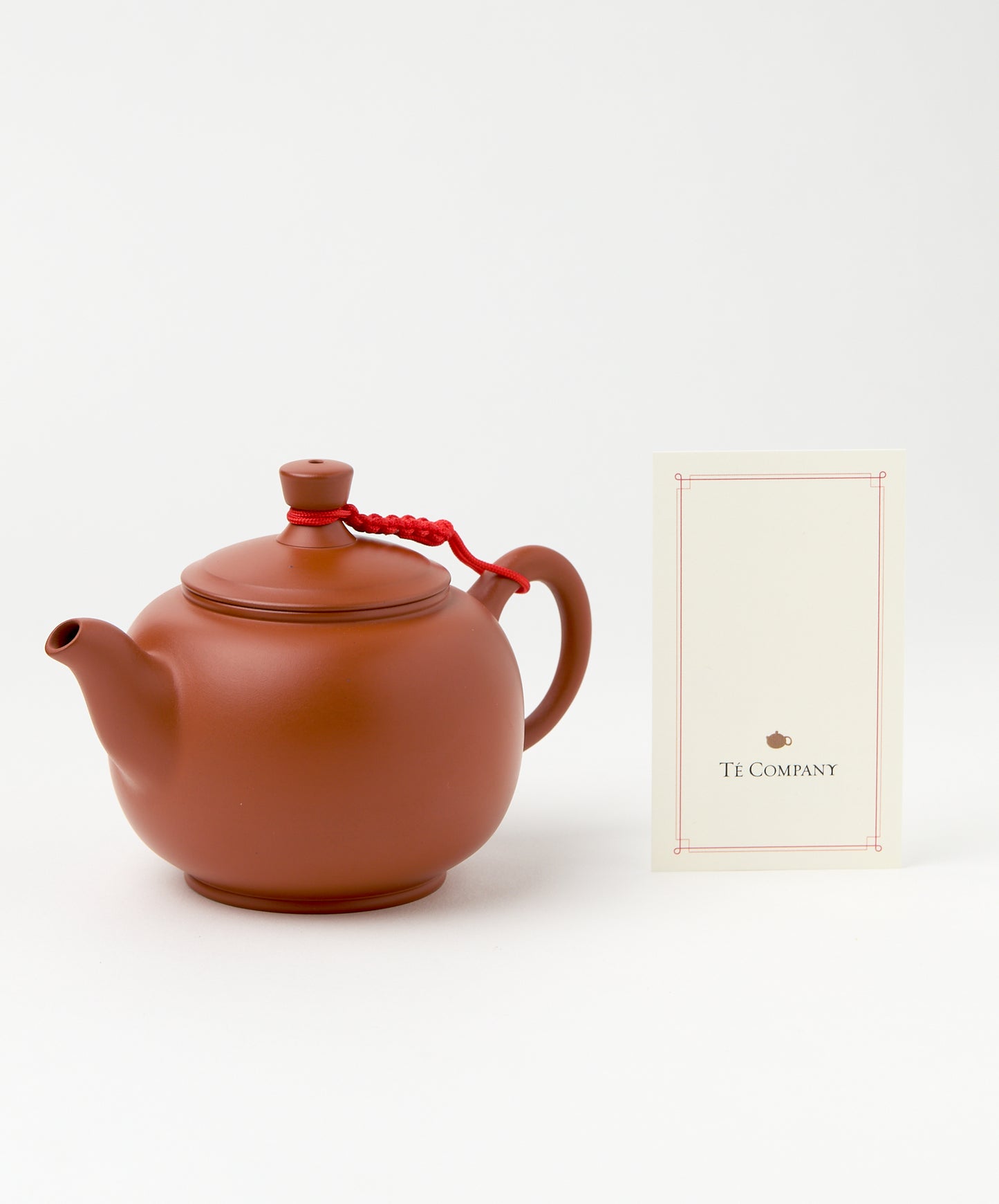 Big Ben teapot displayed next to a Té Company card.