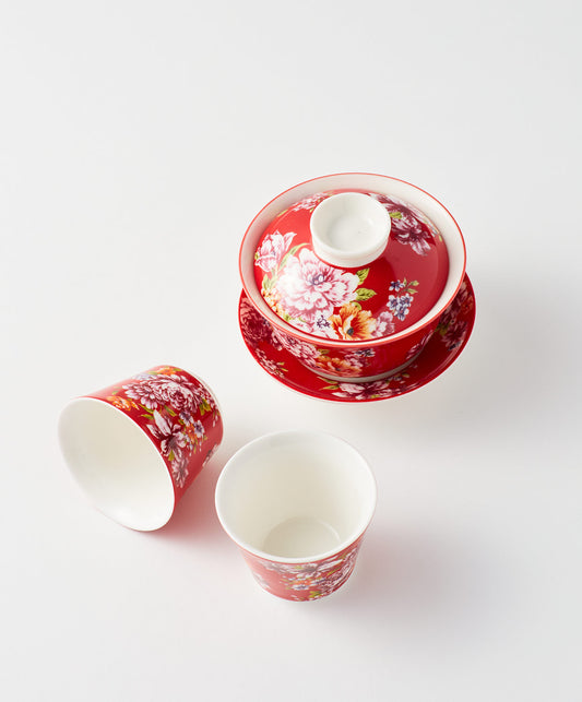 Floral gaiwan with lid and two matching cups.