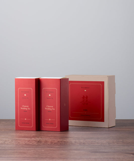 Two ‘Choicest Wedding Tea’ boxes with a larger gift box in the background.