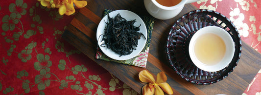 dry tea leaves plate and tea cup