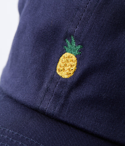 Navy blue cap with a embroidered yellow pineapple on a white background