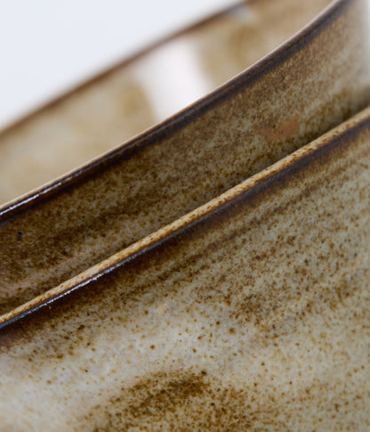Close-up of a ceramic bowl with a textured surface