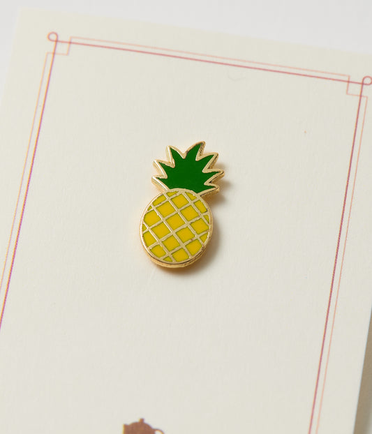 Pineapple-shaped pin on a white background