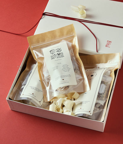 Opened Lunar New Year snack gift box with assorted treats