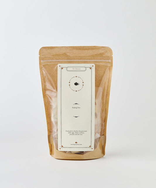 Brown kraft paper pouch packaging for almond nougat, with a minimalist label design displaying product information and a simple circular illustration.