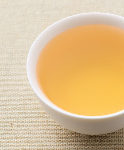 assam white tea liquid in a cup