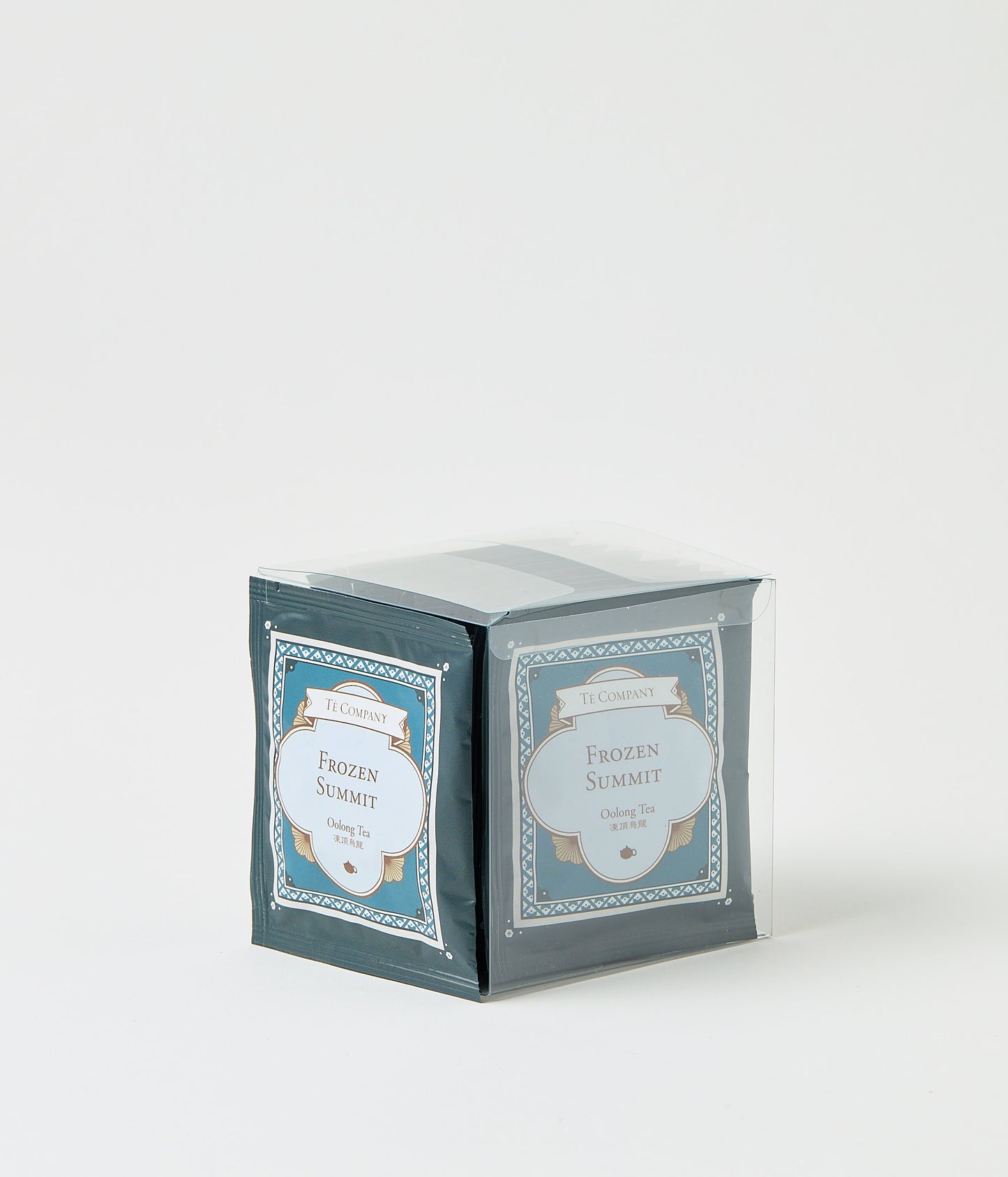 Stack of Te Company Frozen Summit oolong tea packets packaged in a clear plastic box against a white background.