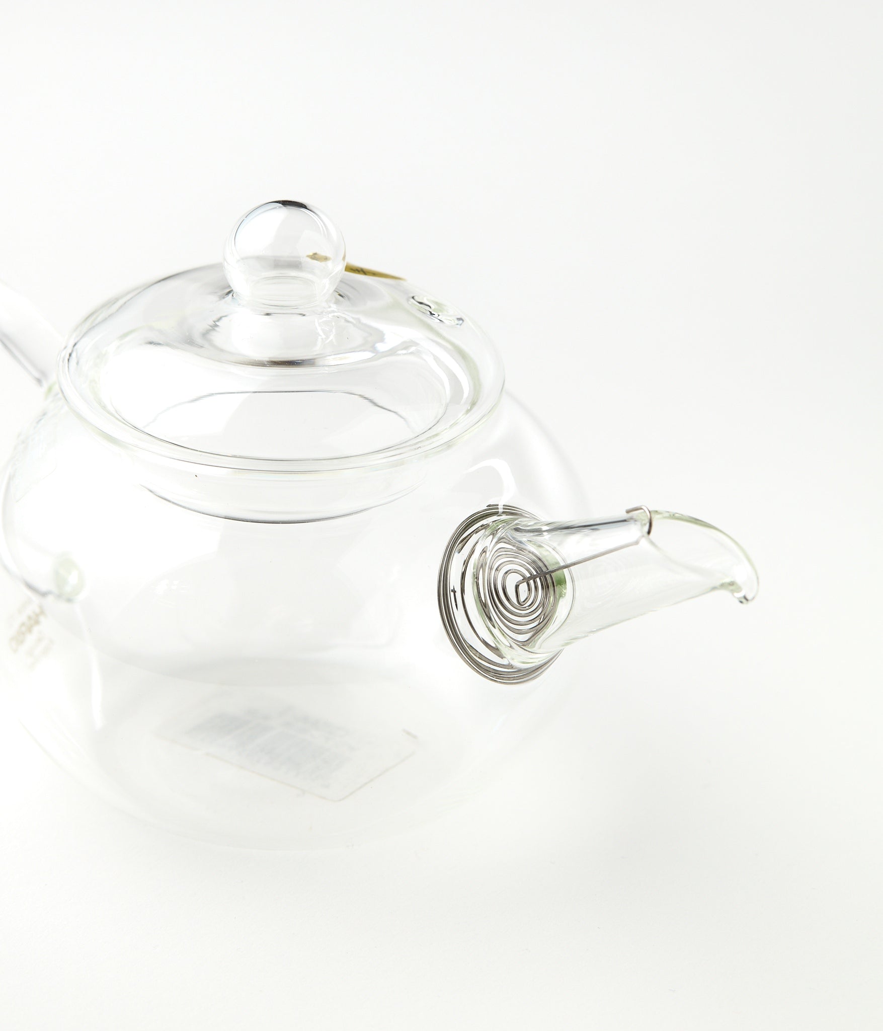 Clear glass teapot on a white background