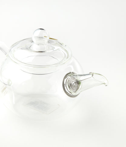 Clear glass teapot on a white background