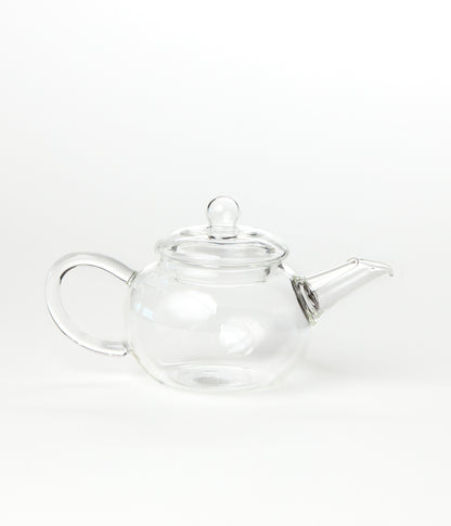 Clear glass teapot on a white background