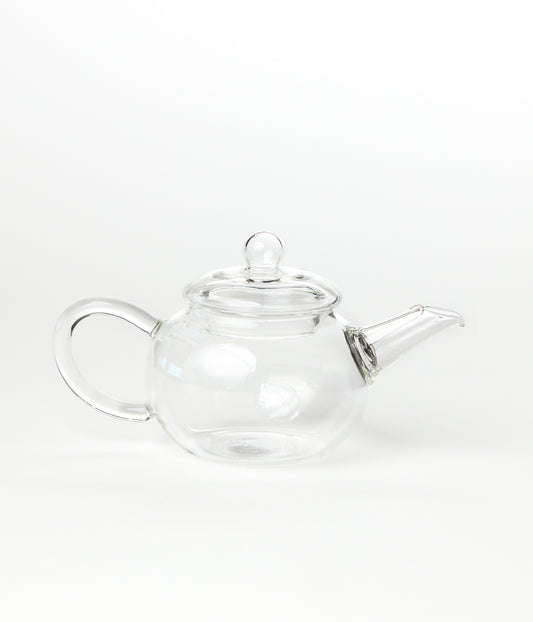 Clear glass teapot on a white background