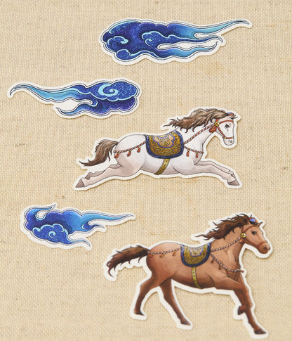Decorative stickers of horses and clouds on a textured beige background