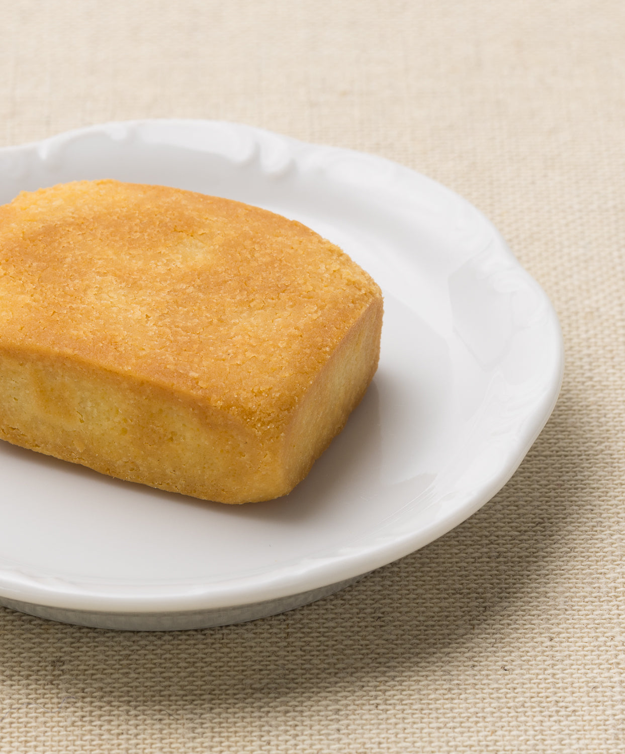 Whole pineapple cake on a white plate