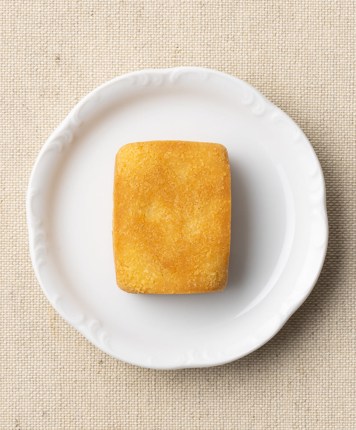 op view of pineapple cake on a white plate