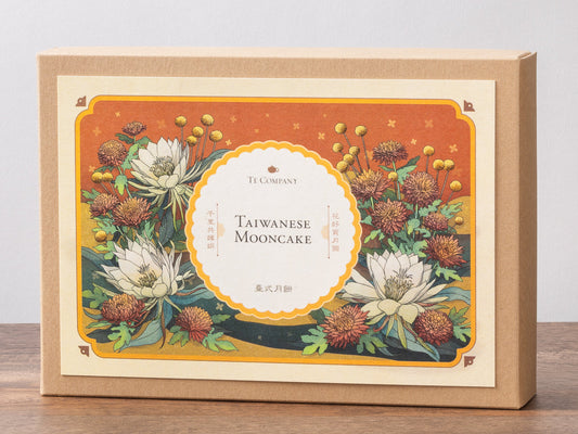 Taiwanese mooncake packaging with floral design on a wooden surface