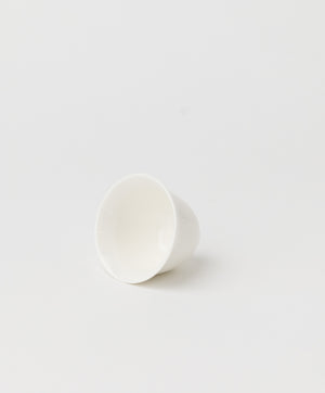 white ceramic tea cup side view