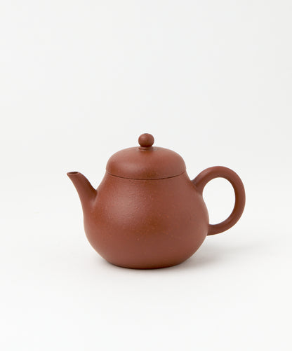 Side view of the Poet Vintage Yixing teapot with lid and handle.