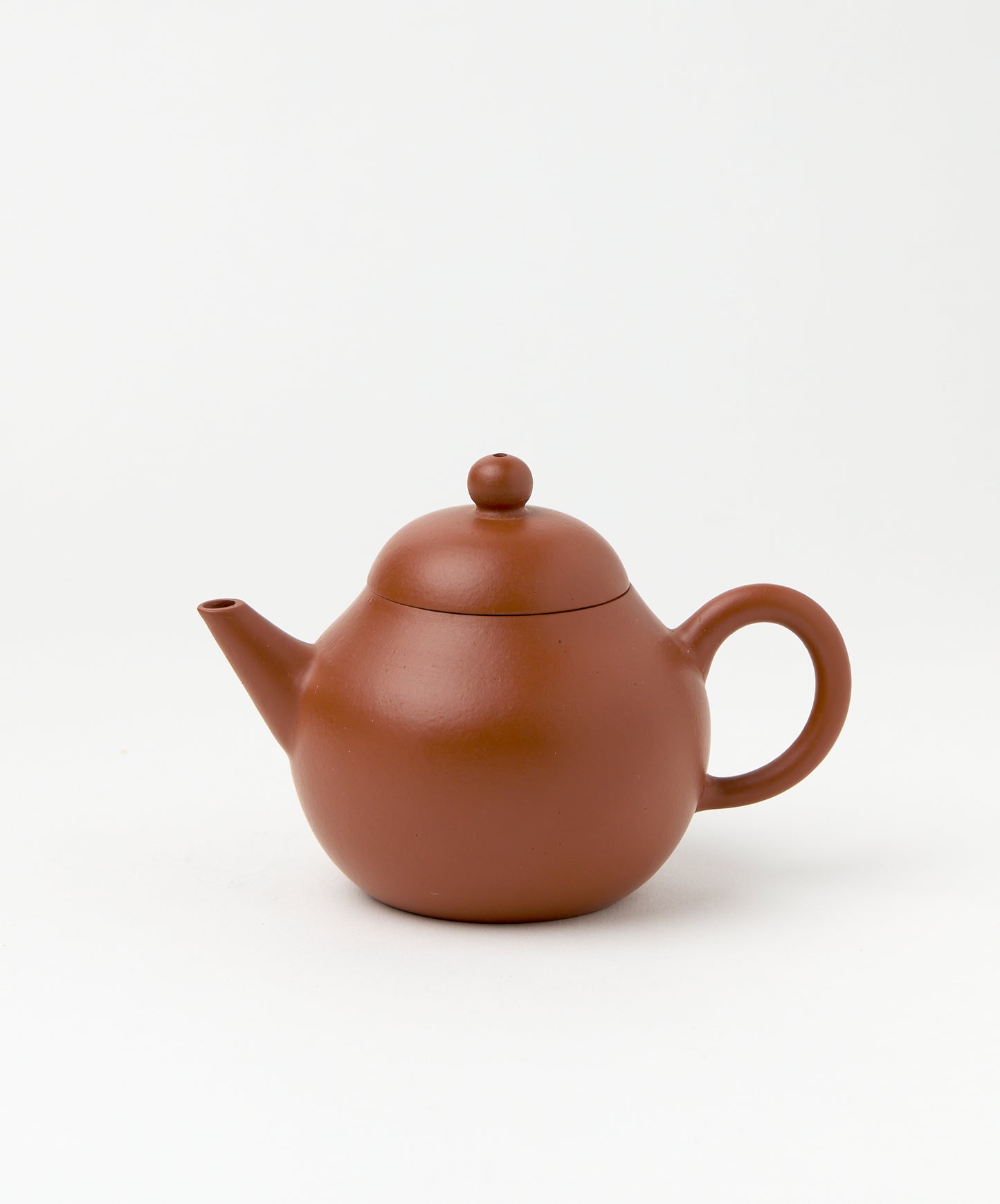 Side view of the Professor Yixing Clay teapot with lid and handle.