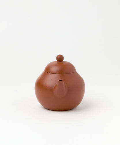 Front view of the Professor Yixing Clay teapot showcasing the spout and lid.