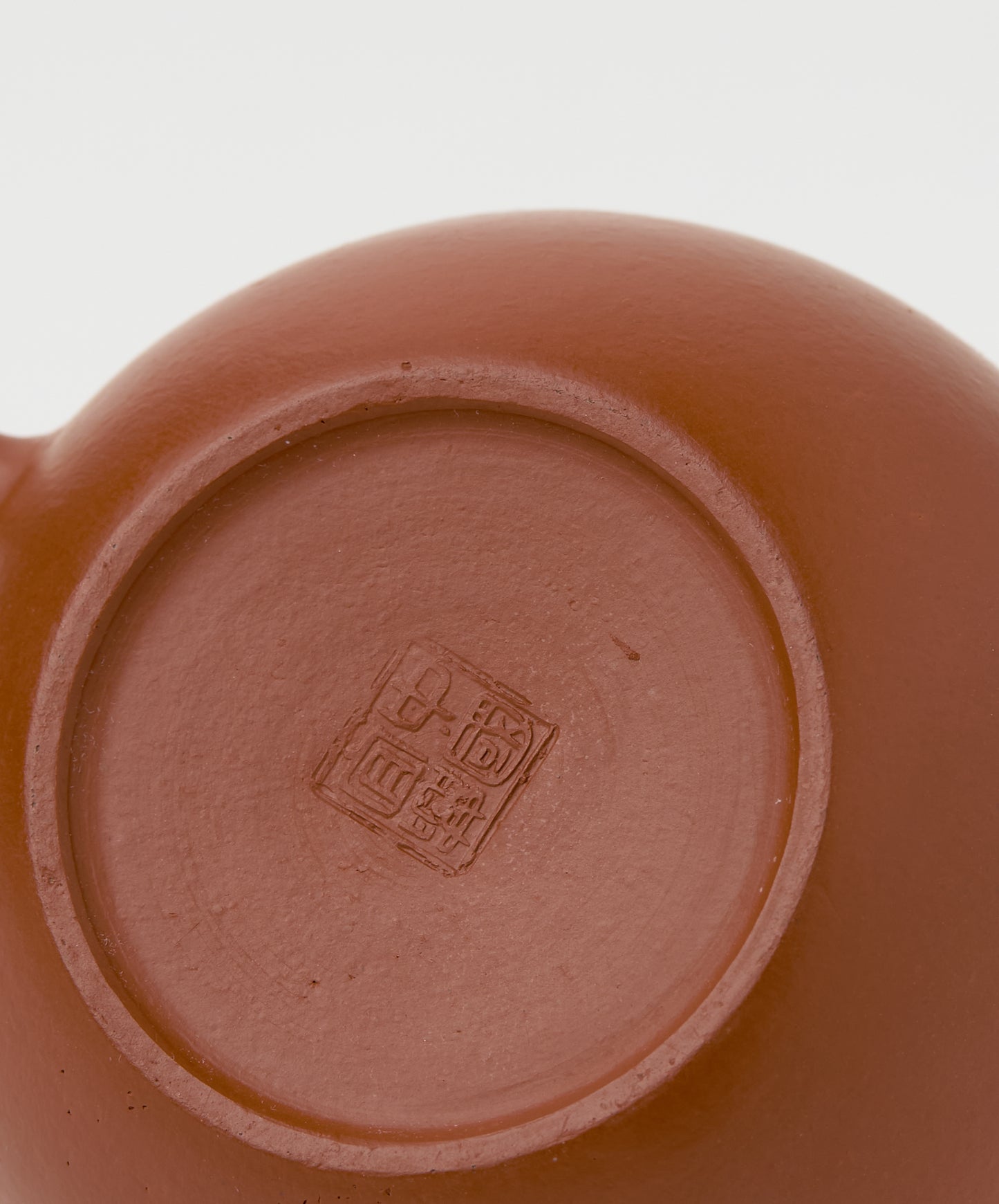 Bottom view of the Professor Yixing Clay teapot with maker’s markings.