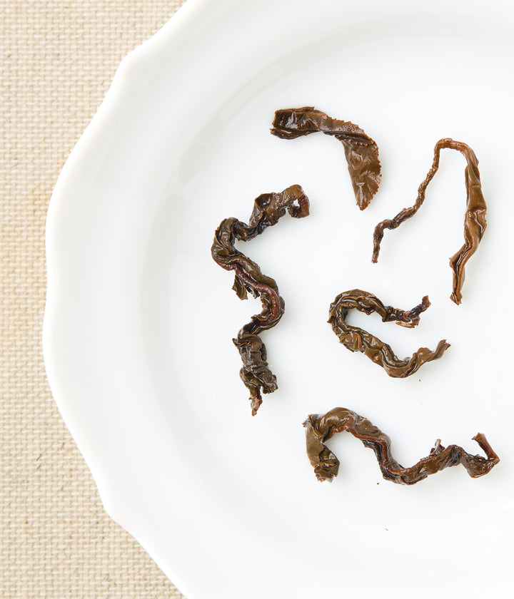 Infused Honeyed Black tea leaves showing twisted full-leaf shape