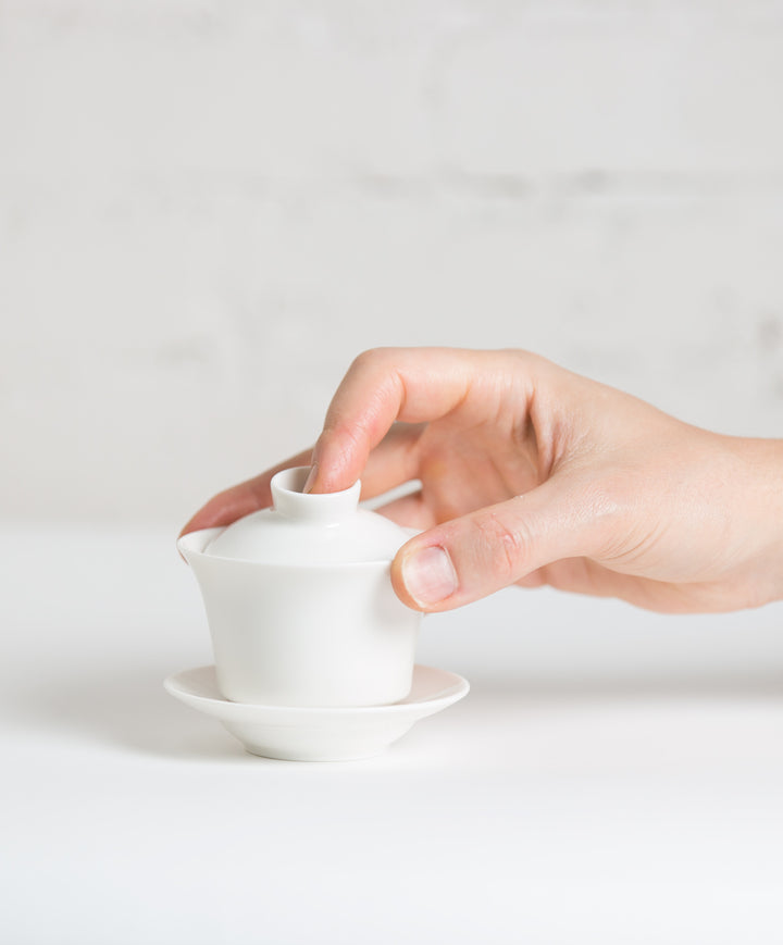 porcelain gaiwan with hand